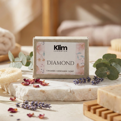 Klim Diamond organic handmade soap on a marble surface with lavender and eucalyptus leaves.